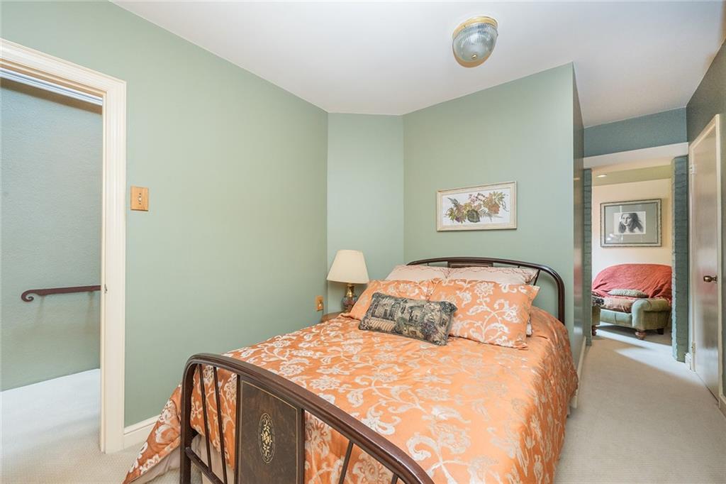 2220 Sarah Street, Unit 1 Pittsburgh, PA 15203 - Photo 19 of 37 a bedroom with a bed and lamp