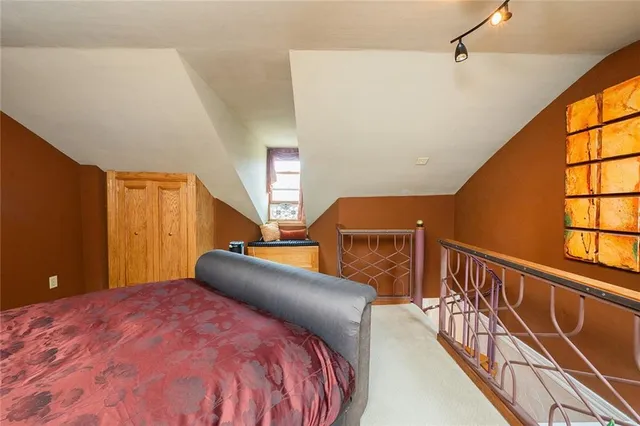 a bedroom with bed and window