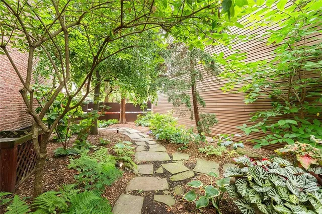 a backyard of a house with lots of green space