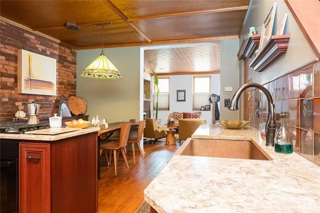 a view of a kitchen and dining area