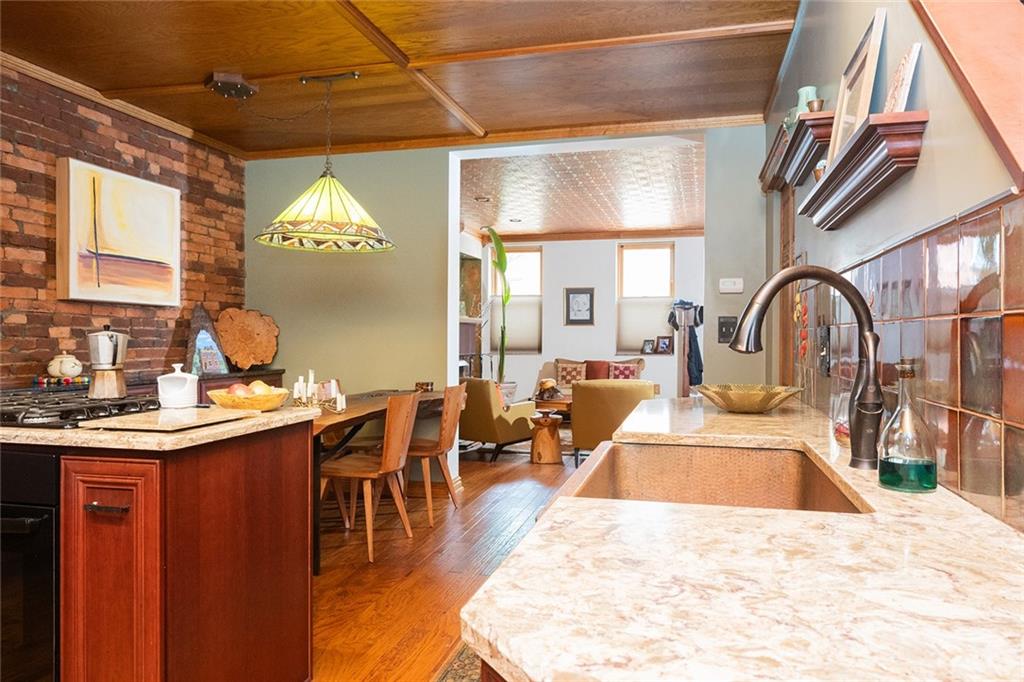 2220 Sarah Street, Unit 1 Pittsburgh, PA 15203 - Photo 9 of 37 a view of a kitchen and dining area