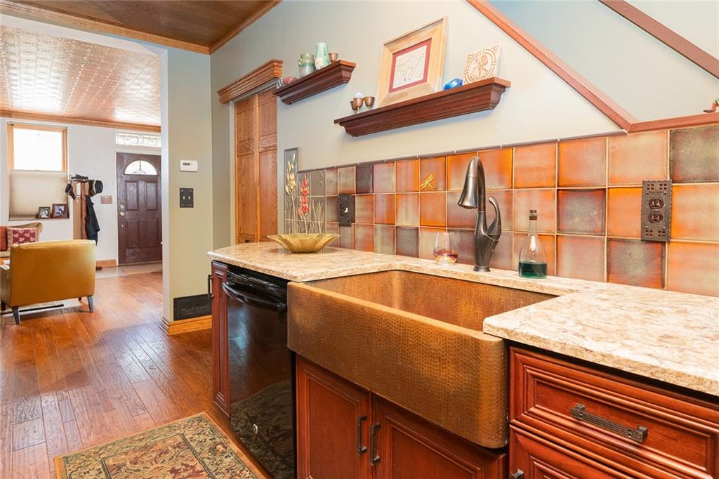 2220 Sarah Street, Unit 1 Pittsburgh, PA 15203 - Photo 10 of 37 a kitchen with a sink and large windows