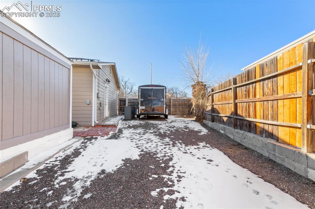 125 Chelton Road Colorado Springs, CO 80909 - Photo 22 of 26 a view of a backyard with a patio