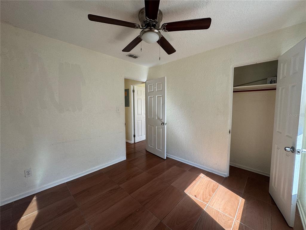 636 Columbia Street Orlando, FL 32805 - Photo 10 of 14 wooden floor in an empty room with a window