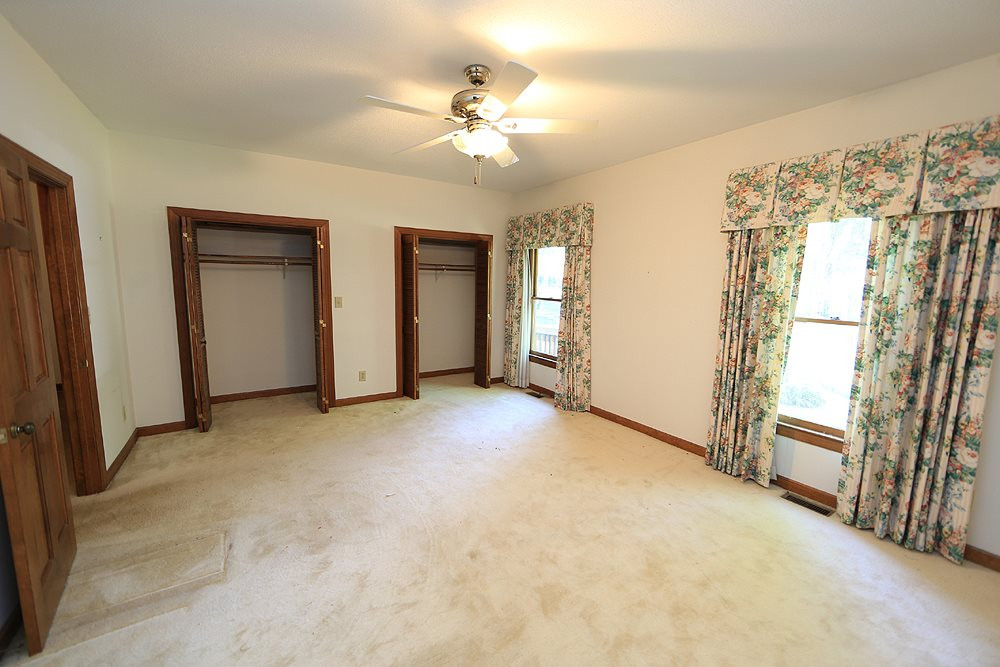 7610 Wilderness Road Raleigh, NC 27613 - Photo 11 of 27 Main Floor Large Bedroom with Built-In Bookcases