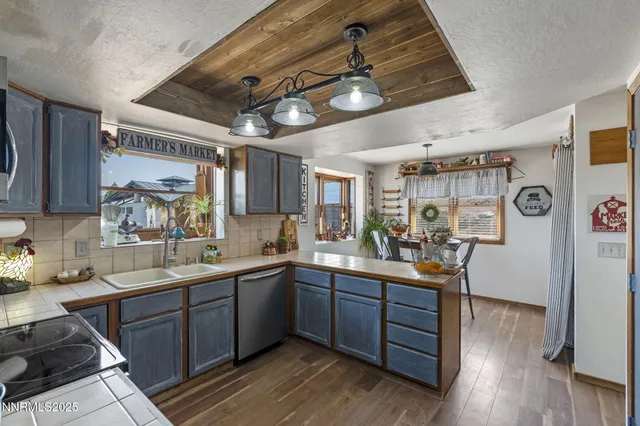 a kitchen with lots of counter top space and sink