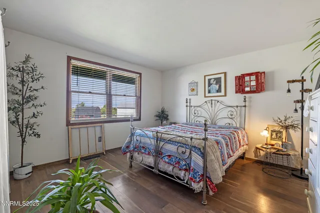 a view of a workspace with furniture and a potted plant