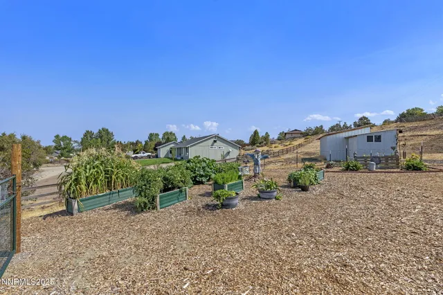 an aerial view of a house with a outdoor space
