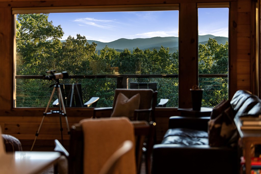 361 June Bug Lane Blue Ridge, GA 30513 - Photo 31 of 65 a view of a balcony with chairs and a potted plant