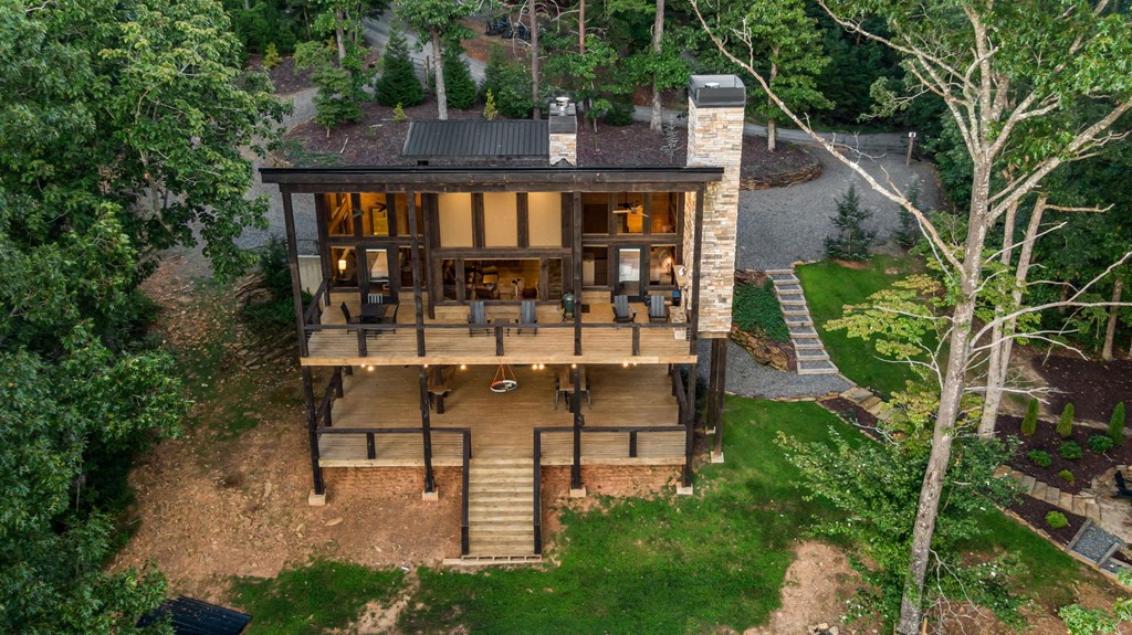 361 June Bug Lane Blue Ridge, GA 30513 - Photo 53 of 65 a view of a chairs and table in backyard of the house