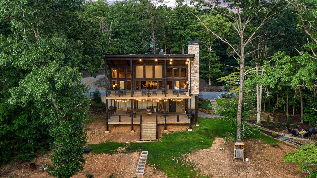 361 June Bug Lane Blue Ridge, GA 30513 - Photo 54 of 65 a view of house with a big yard and large trees