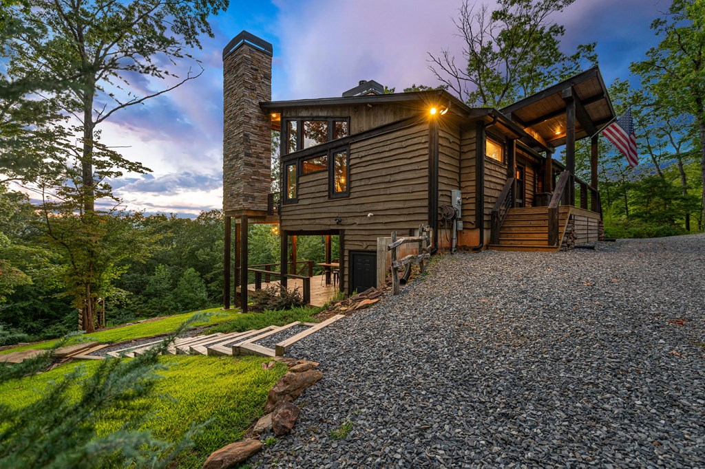 361 June Bug Lane Blue Ridge, GA 30513 - Photo 6 of 65 a view of a house with backyard and sitting area
