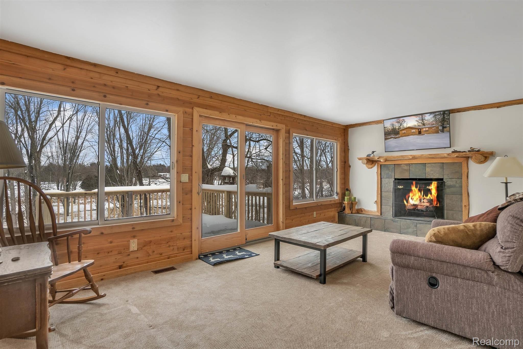 1084 Darwin Road Pinckney, MI 48169 - Photo 11 of 36 Gorgeous Views From The Wall Of Windows In The Family Room
