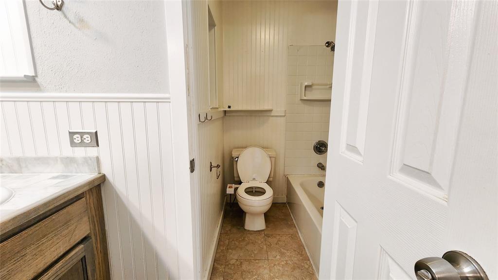 3905 Windflower Lane Fort Worth, TX 76137 - Photo 24 of 32 a bathroom with a sink and a toilet