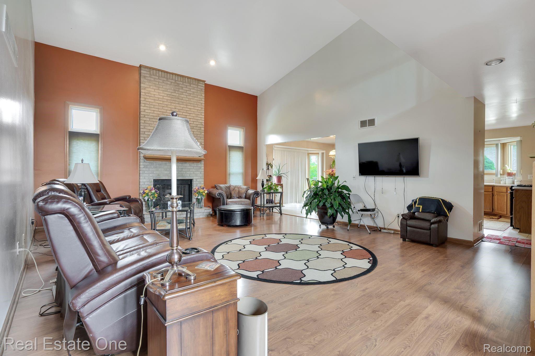 50285 Riverside Drive Macomb, MI 48044 - Photo 6 of 39 SPACIOUS GREAT ROOM WITH GAS FIREPLACE