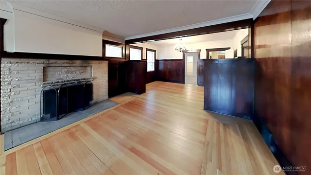 a view of an empty room with a fireplace