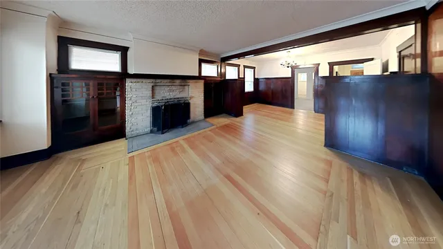 a view of a hallway with a dining area with chandelier