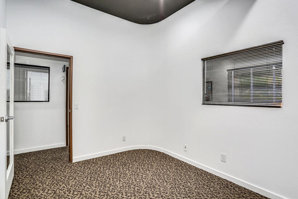 750 East Tahquitz Canyon Way, Unit 5 Palm Springs, CA 92262 - Photo 14 of 19 a view of an empty room with a window