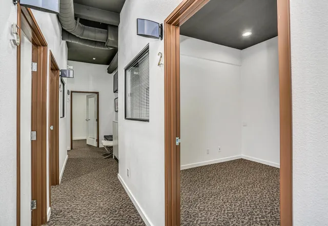 a kitchen with stainless steel appliances a refrigerator and a table