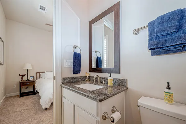 a bedroom with a bed and a shower