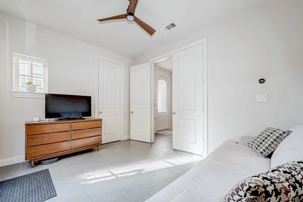 a spacious bathroom with a tub sink and mirror