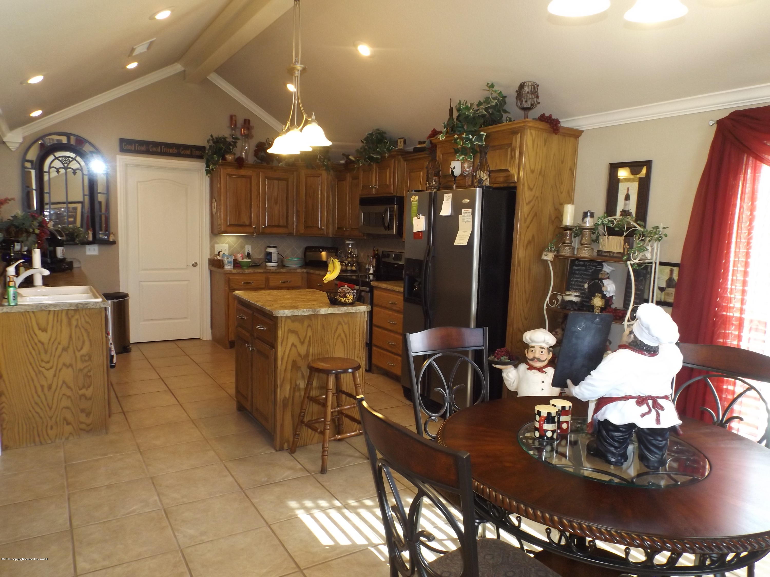 6917 Thunder Road Amarillo, TX 79119 - Photo 5 of 26 Dining Room into Kitchen