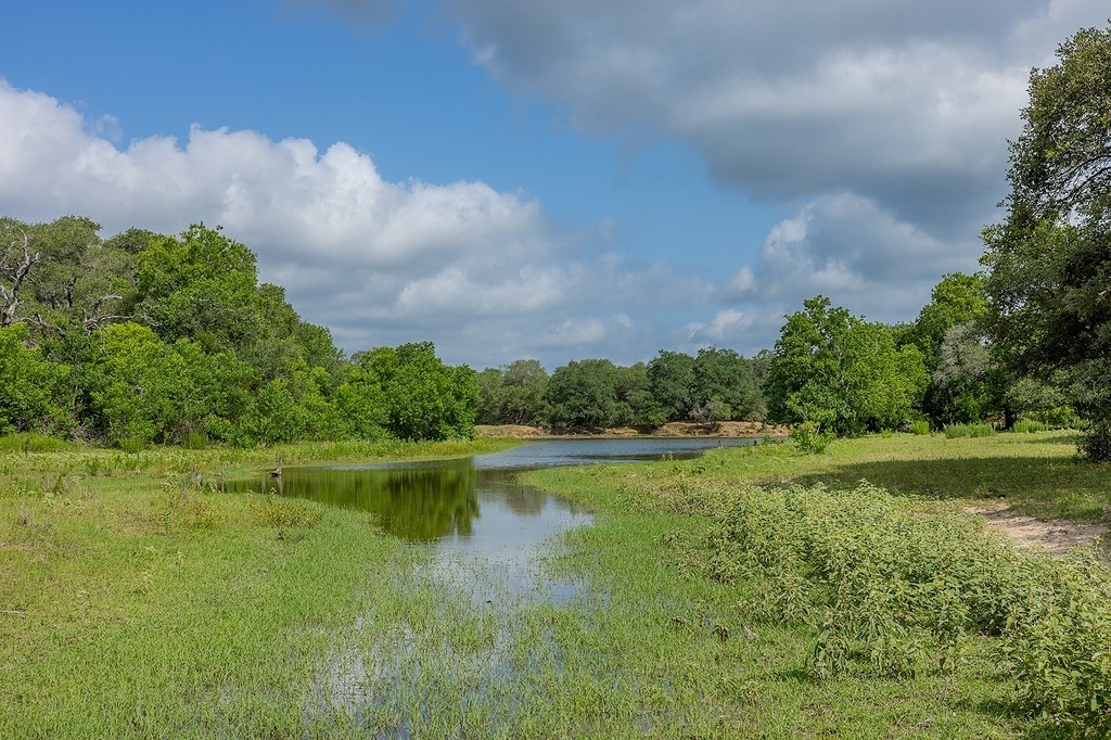 1561 Cr 154 Road Weimar, TX 78962 - Photo 18 of 46 a view of a lake with a big yard