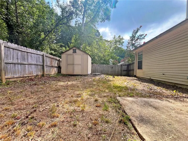a house view with a backyard space