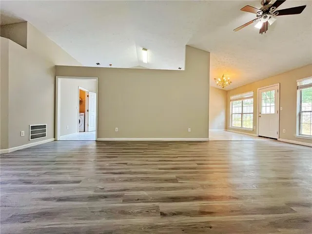 a view of a room with window and wooden floor