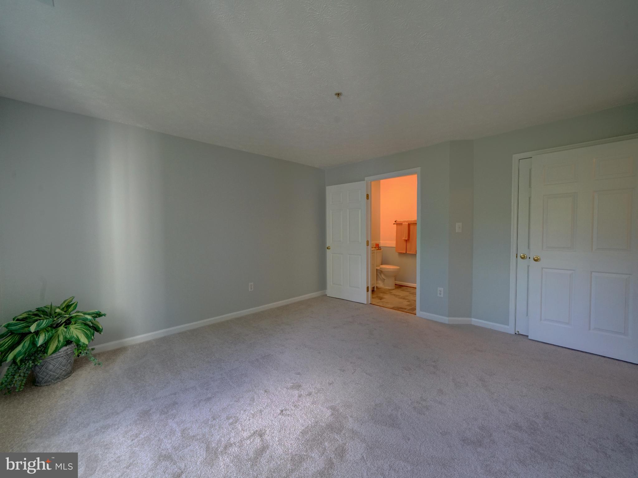 693 Winding Stream Way, Unit 103 Odenton, MD 21113 - Photo 12 of 26 a view of an empty room with a window