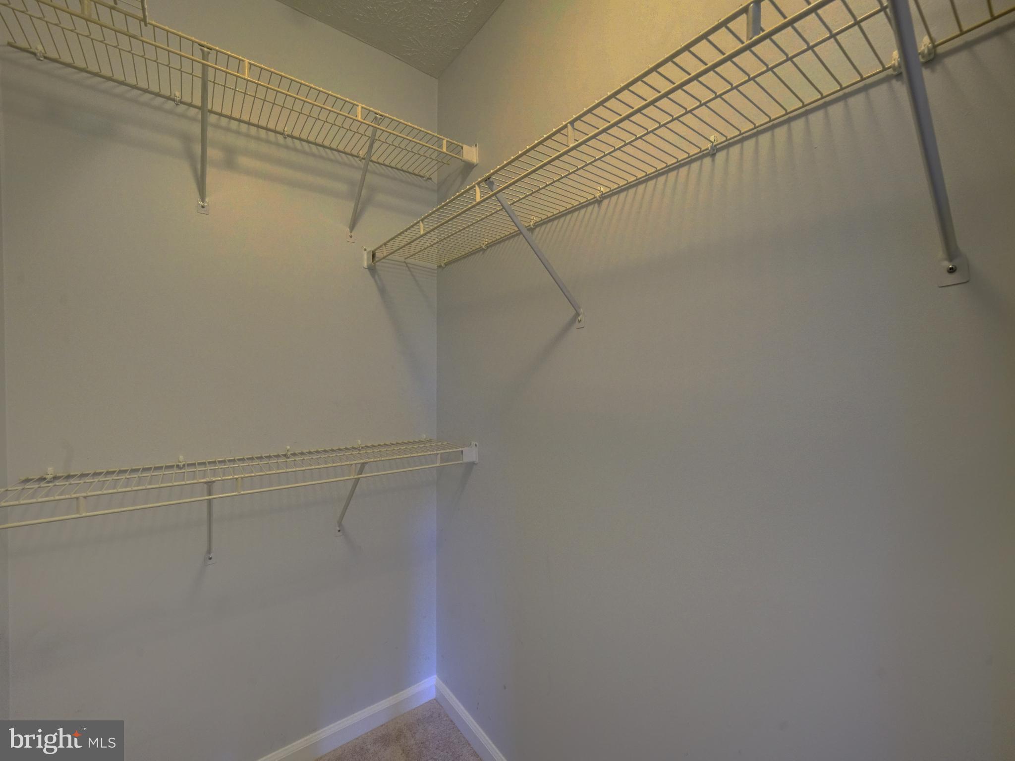 693 Winding Stream Way, Unit 103 Odenton, MD 21113 - Photo 16 of 26 a view of a room with racks on the wall