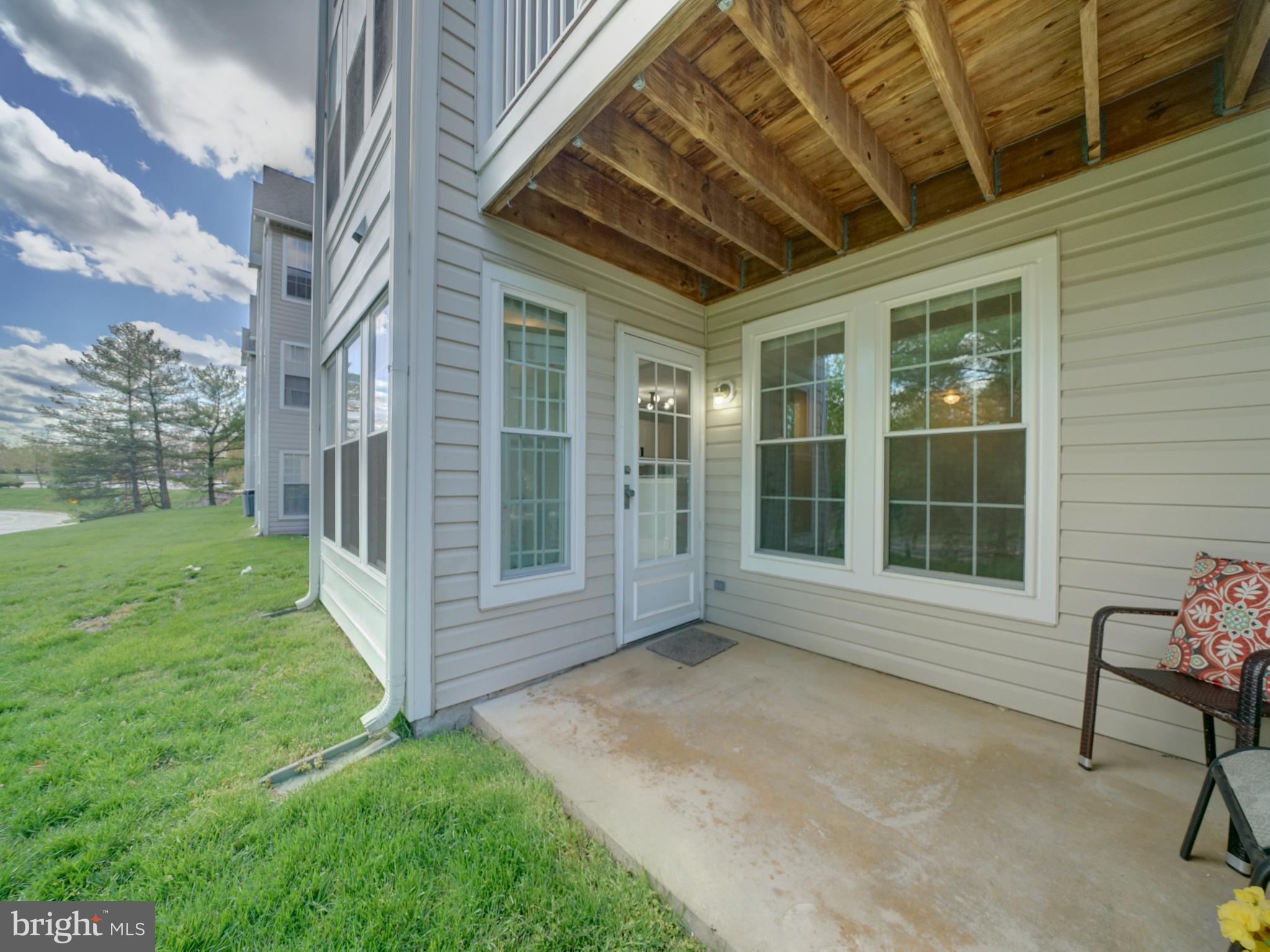 693 Winding Stream Way, Unit 103 Odenton, MD 21113 - Photo 22 of 26 a view of front door with seating space