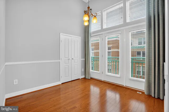 an empty room with windows and entrance