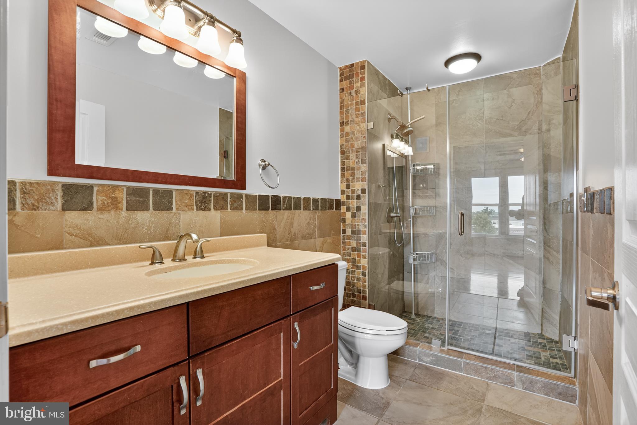 12000 Market Street, Unit 490 Reston, VA 20190 - Photo 18 of 43 Stylish master bathroom with elegant finishes