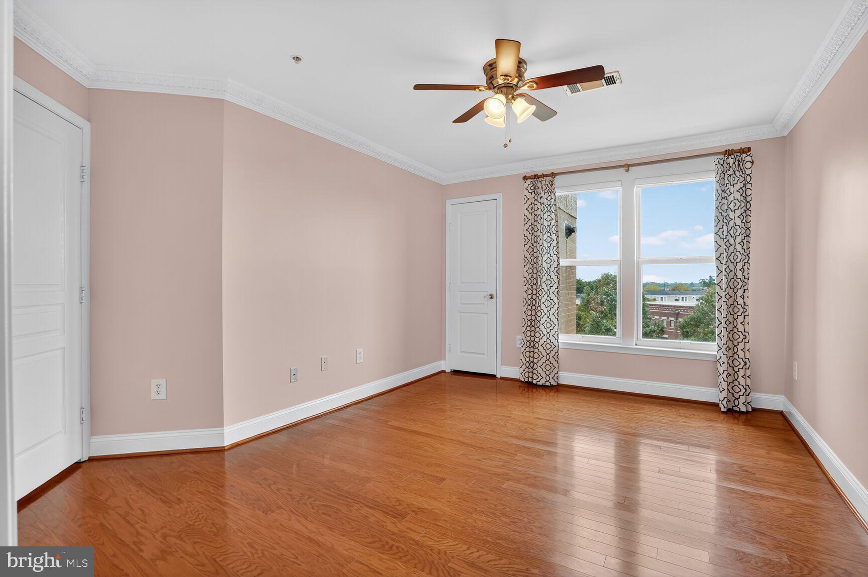 12000 Market Street, Unit 490 Reston, VA 20190 - Photo 19 of 43 Bright and airy master bedroom with scenic views.