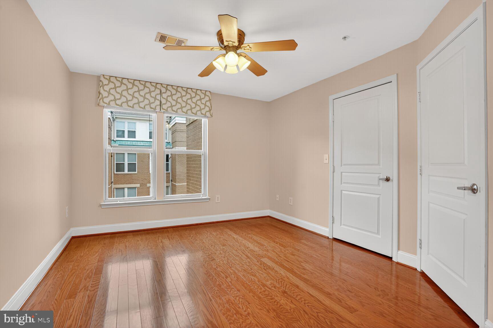 12000 Market Street, Unit 490 Reston, VA 20190 - Photo 21 of 43 Second bright and airy room with polished floors.