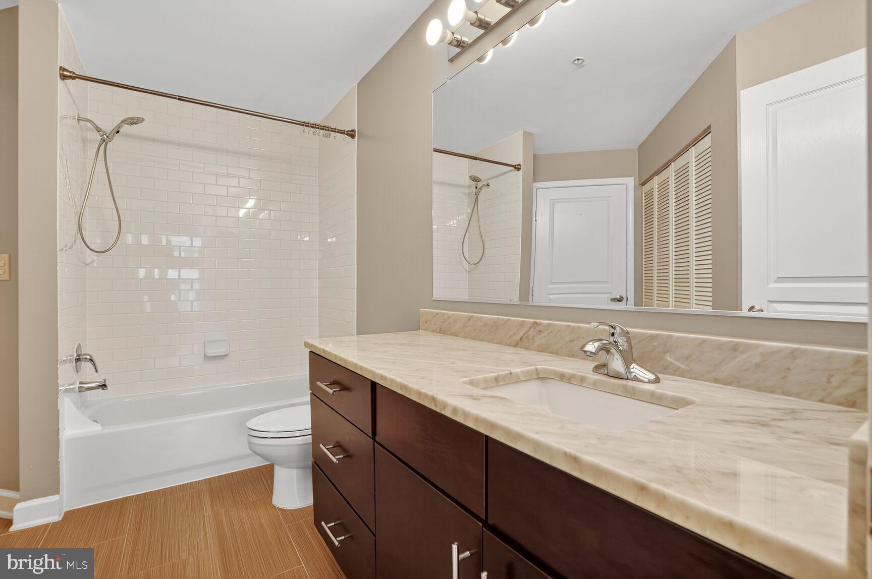 12000 Market Street, Unit 490 Reston, VA 20190 - Photo 23 of 43 Bathroom 2 - sleek and bright with laundry closet