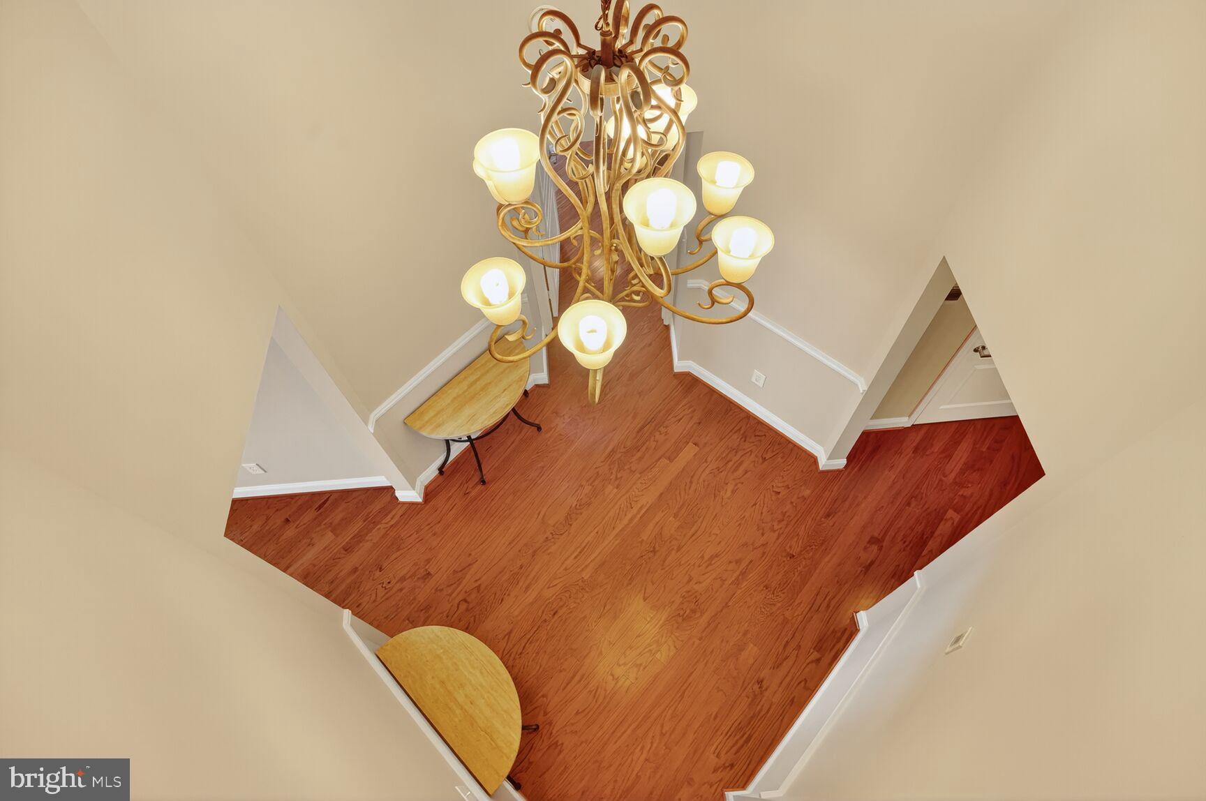 12000 Market Street, Unit 490 Reston, VA 20190 - Photo 28 of 43 Exit through stunning foyer (as seen from above)