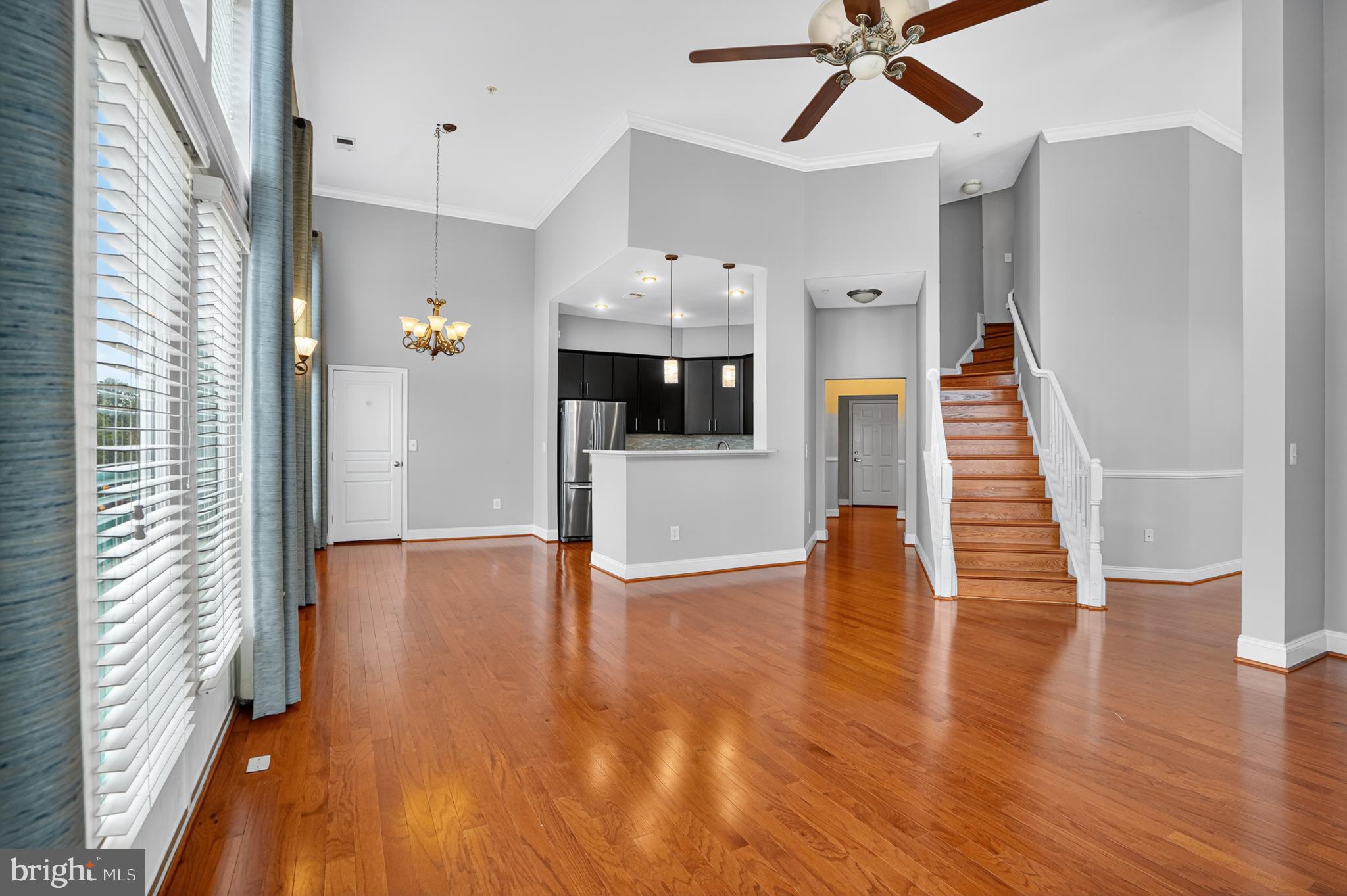 12000 Market Street, Unit 490 Reston, VA 20190 - Photo 5 of 43 Gleaming hardwood floors throughout