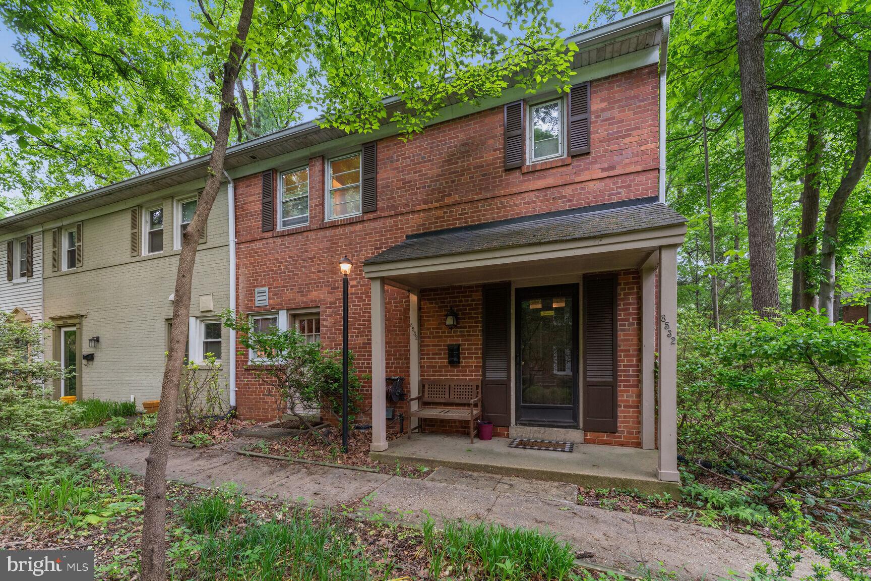 8532 Geren Road, Unit 174 Silver Spring, MD 20901 - Photo 1 of 12 front view of a house with a small yard