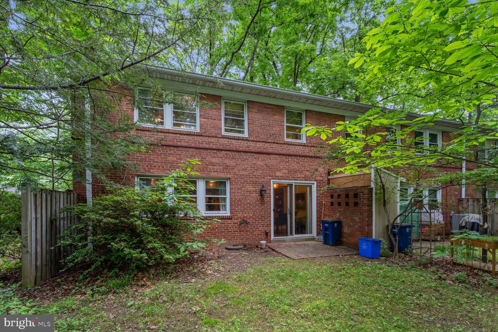 8532 Geren Road, Unit 174 Silver Spring, MD 20901 - Photo 11 of 12 a view of a house with a yard and sitting area