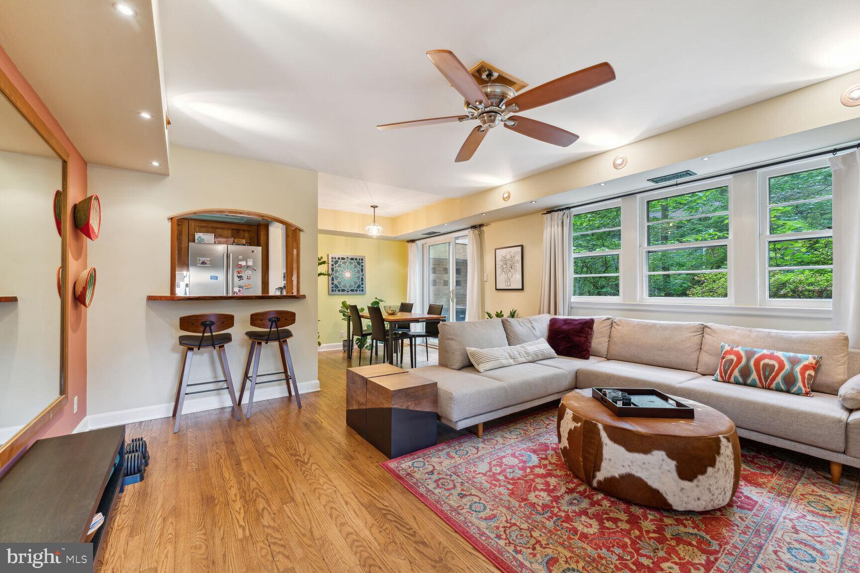 8532 Geren Road, Unit 174 Silver Spring, MD 20901 - Photo 2 of 12 a living room with furniture and a large window