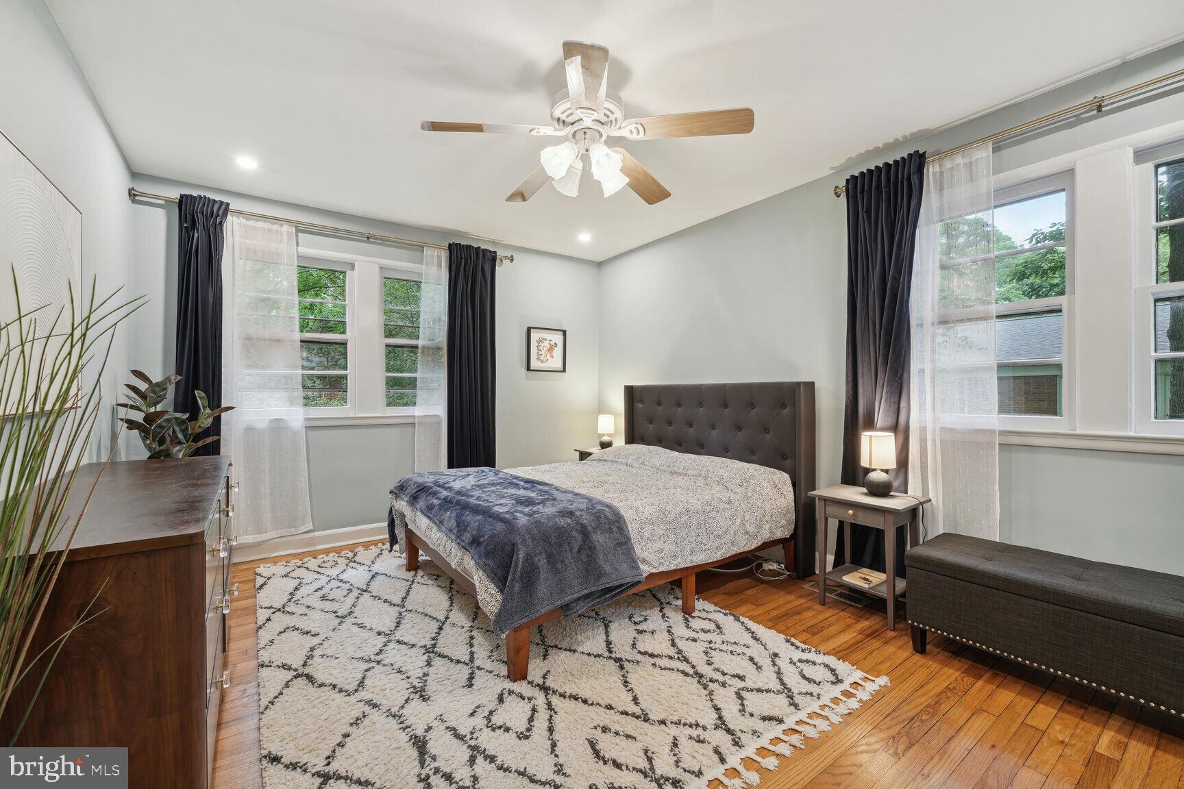 8532 Geren Road, Unit 174 Silver Spring, MD 20901 - Photo 7 of 12 a bedroom with a bed and a large window with the outer view
