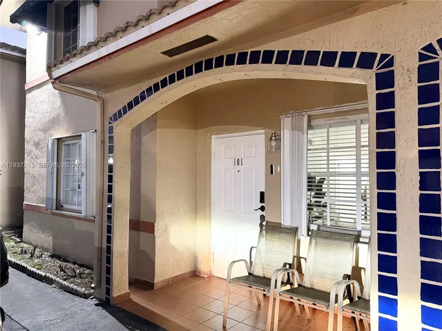 a front view of a house with a swimming pool