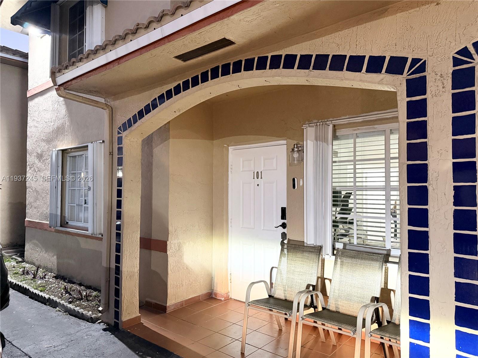 3262 West 70th Street, Unit 101 Hialeah, FL 33018 - Photo 1 of 20 a front view of a house with a swimming pool