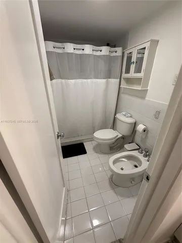 a bathroom with a sink and toilet