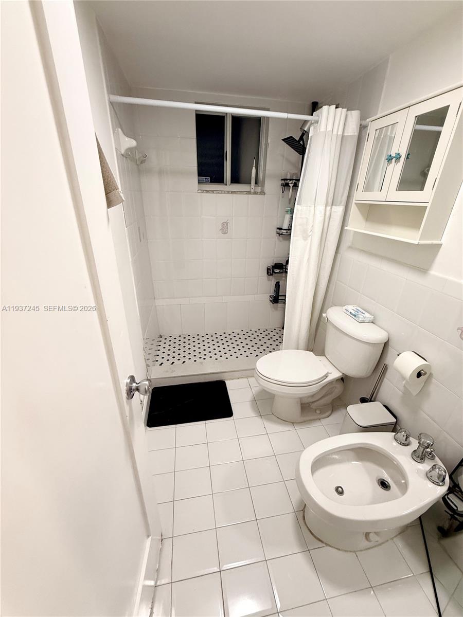 3262 West 70th Street, Unit 101 Hialeah, FL 33018 - Photo 16 of 20 a bathroom with a toilet and a shower