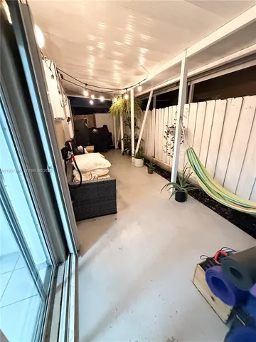 a storage room with stairs and a couch