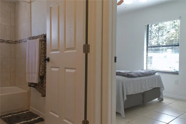 a bathroom with a tub and a window