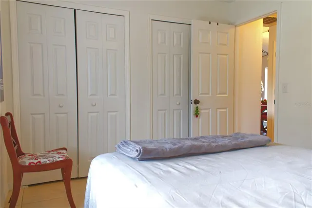 a view of a bedroom with closet area